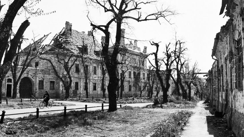 A lone bicyclist rides through the ruins of Vukovar, Croatia, on Thursday, November 7, 1991.Photographer: Mark H. Milstein/ Northfoto